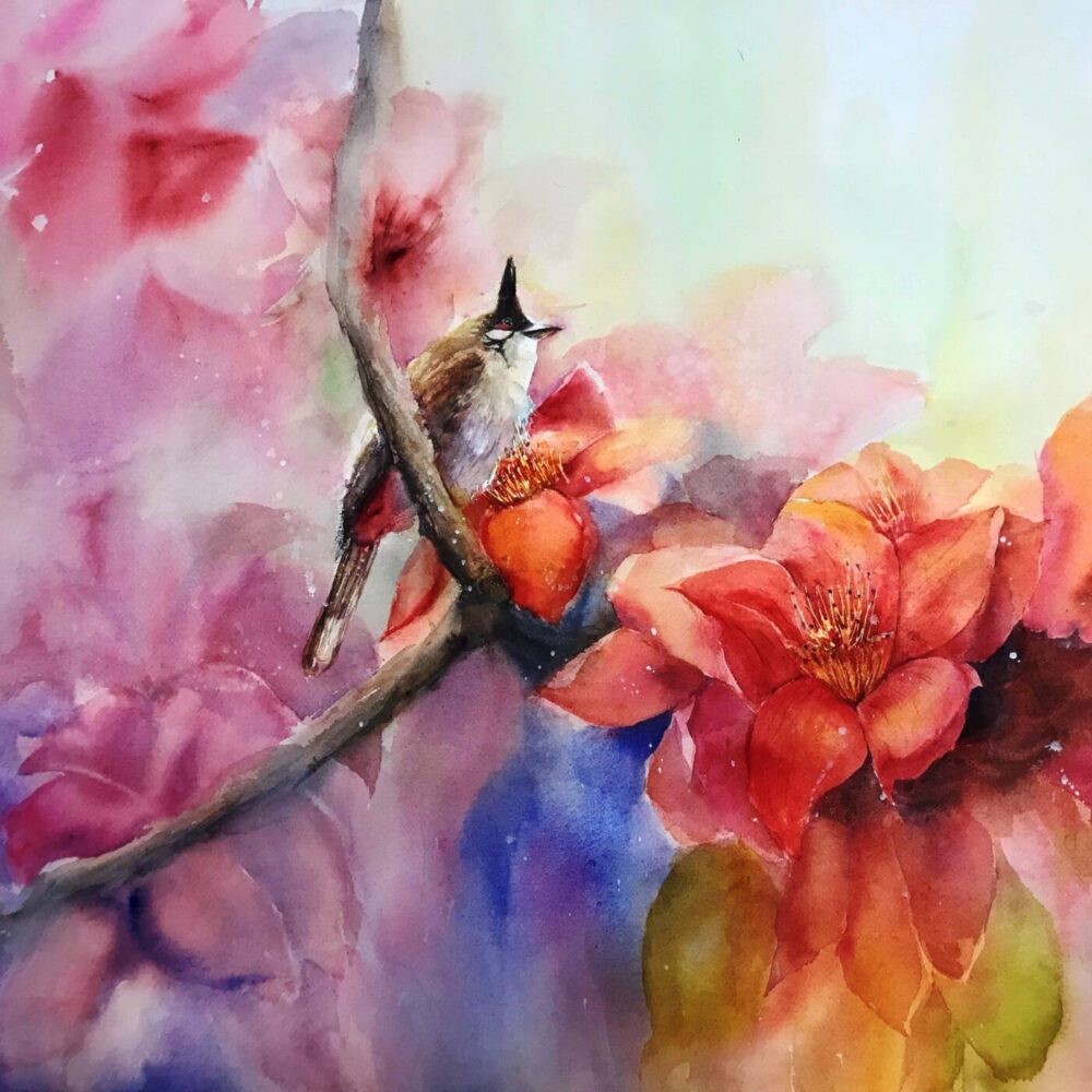 The Spring Song watercolor art print features a small bird perched on a branch amidst vibrant red and orange flowers, with a dreamy background of soft pink, blue, and green hues.