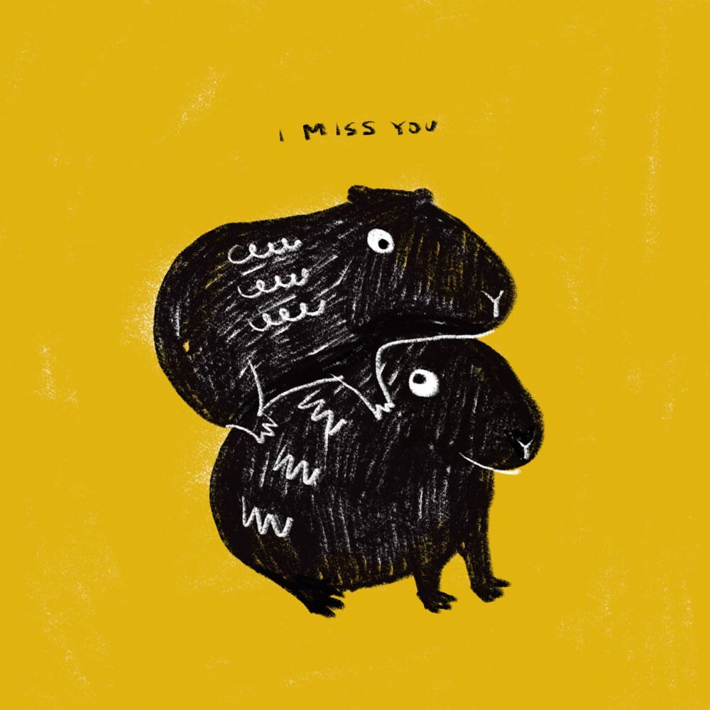 A whimsical art print titled I MISS YOU features two black animals with simple, playful characteristics and scribbled textures hugging against a yellow background, with the text overhead.