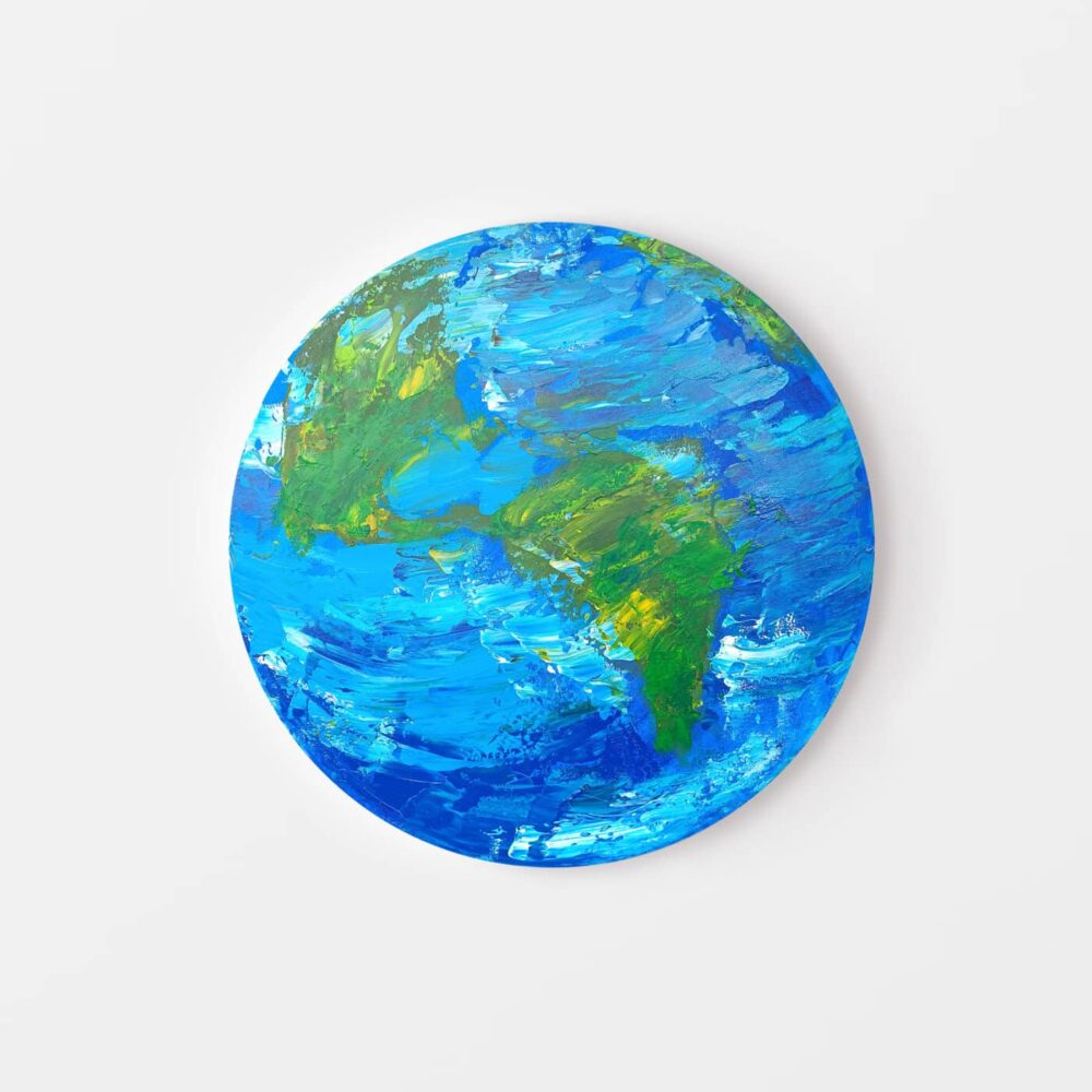 The La Terre Bouleversée circular canvas art print displays a vivid, abstract Earth painting with blue oceans and green landmasses. Its textured, swirling brushstrokes offer a dynamic, colorful representation of the planet.