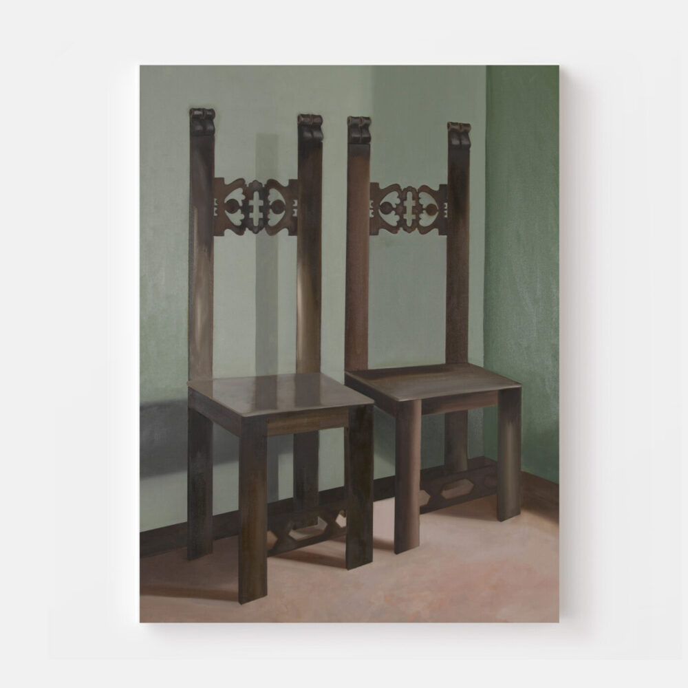 The CURIALE art print showcases two tall, dark wooden chairs with ornate backs set against a green wall. Their soft shadows stretch gracefully across the light floor, creating a serene and elegant scene.