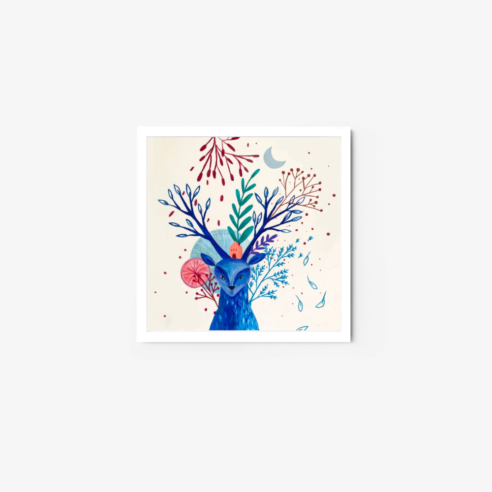 A vibrant deer art print showcases a blue deer with branch-like antlers, set against a backdrop of red and purple branches, abstract shapes, and a crescent moon on a light background, all encased in a white frame.